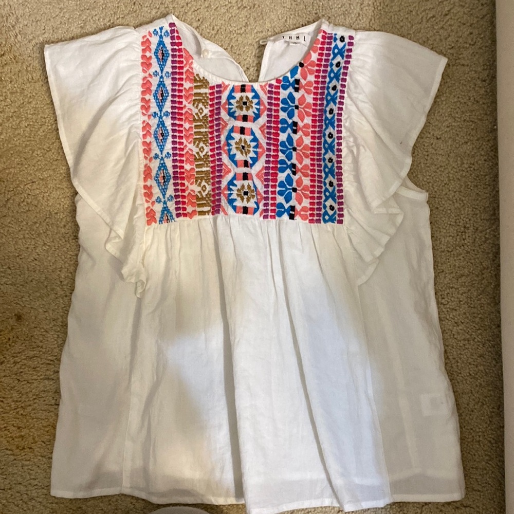 Women’s blouse with festive string decor on the front